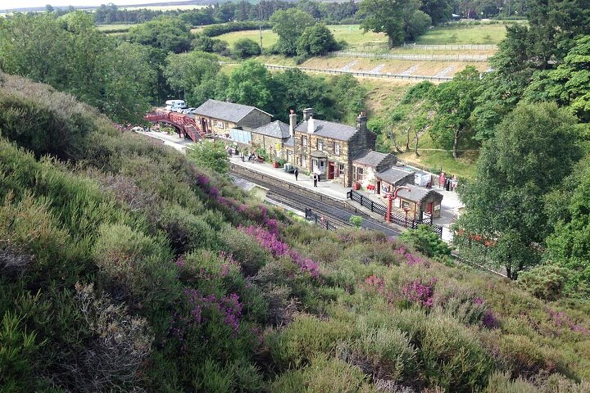 a train station with a train on the tracks