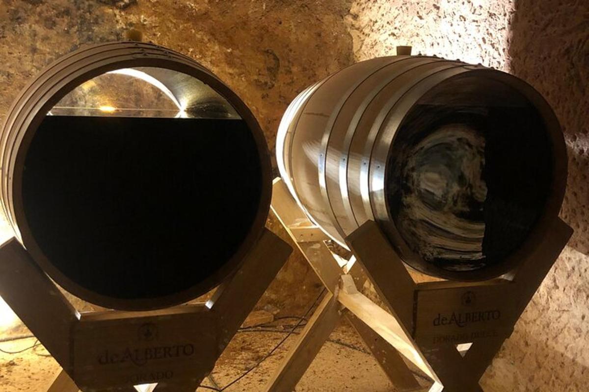 a metal object on a stand next to a barrel