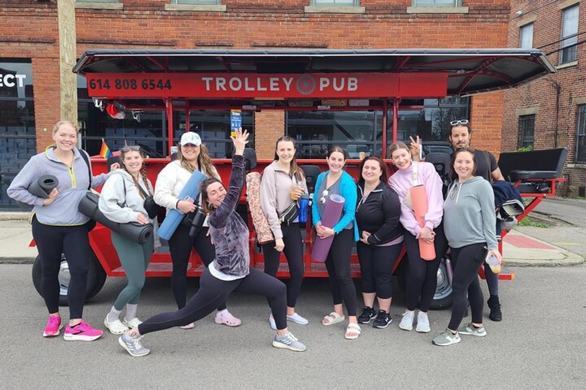 a group of people standing in front of a bus