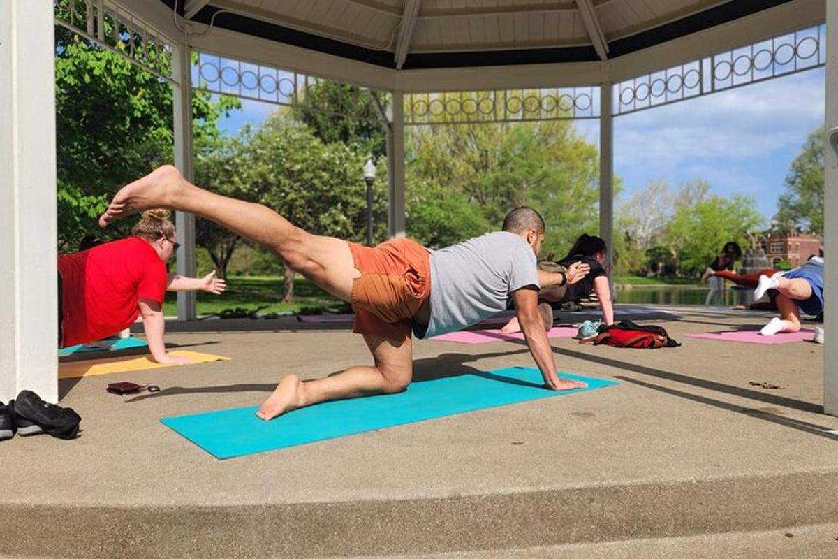 a man doing a push up in a yoga class