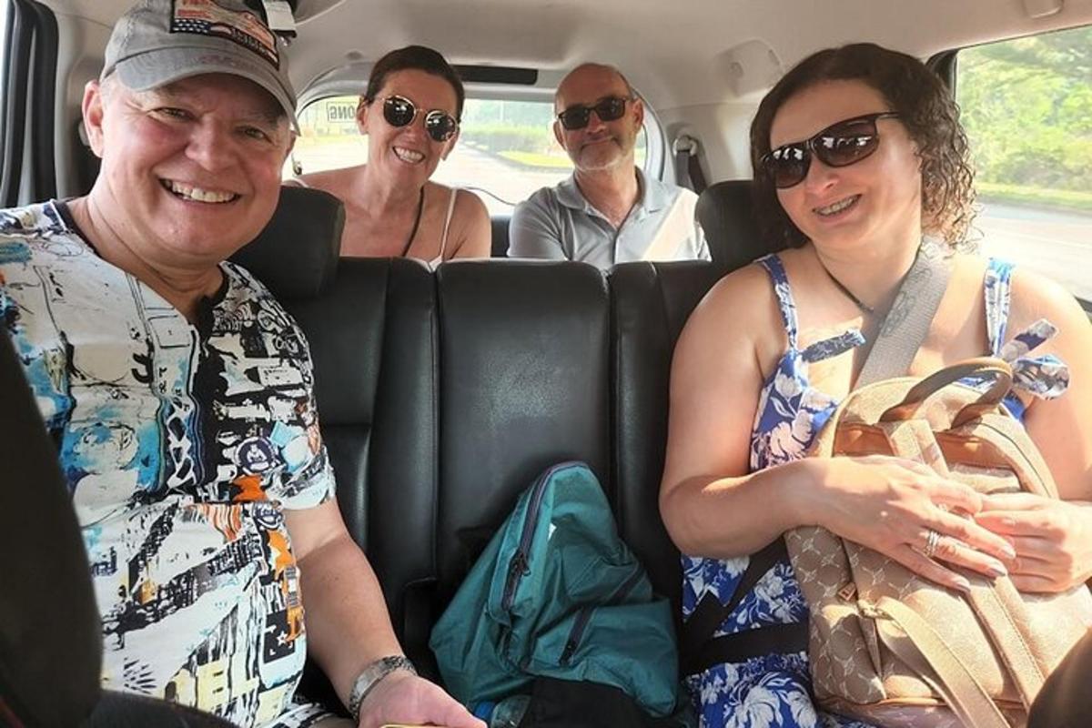 a group of people sitting in the back of a car