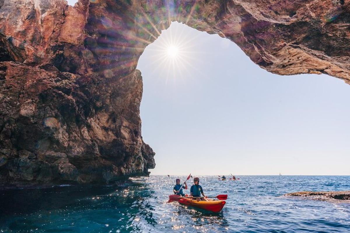 a group of people in a boat in the water