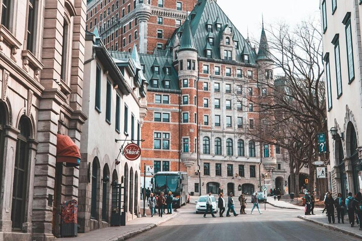 a city street with buildings and people walking on the street