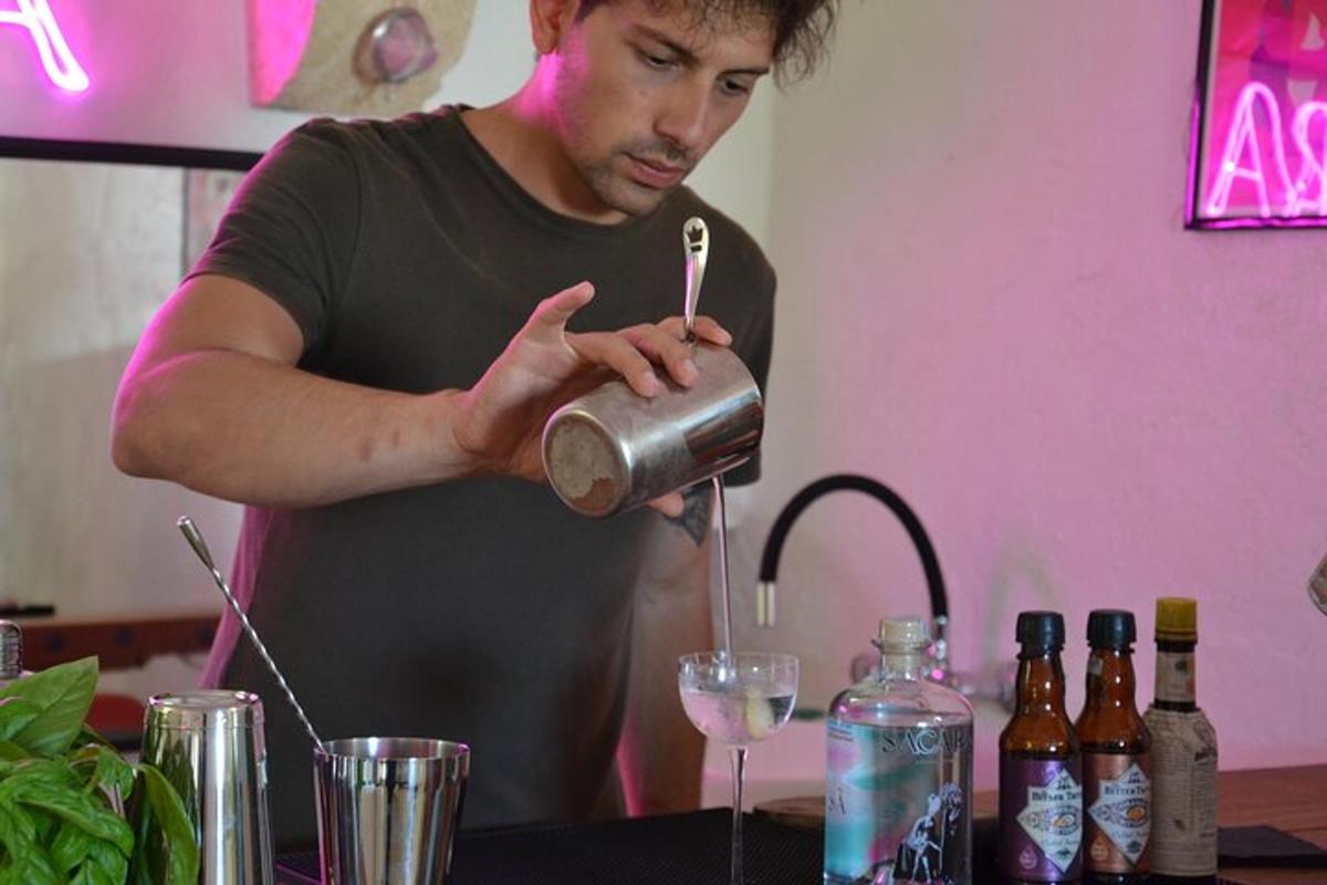 a man is pouring a drink into a glass