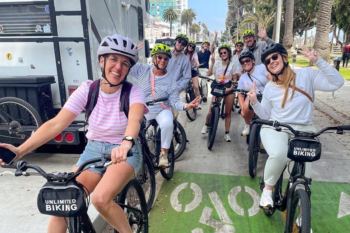 a group of people riding bikes on a street