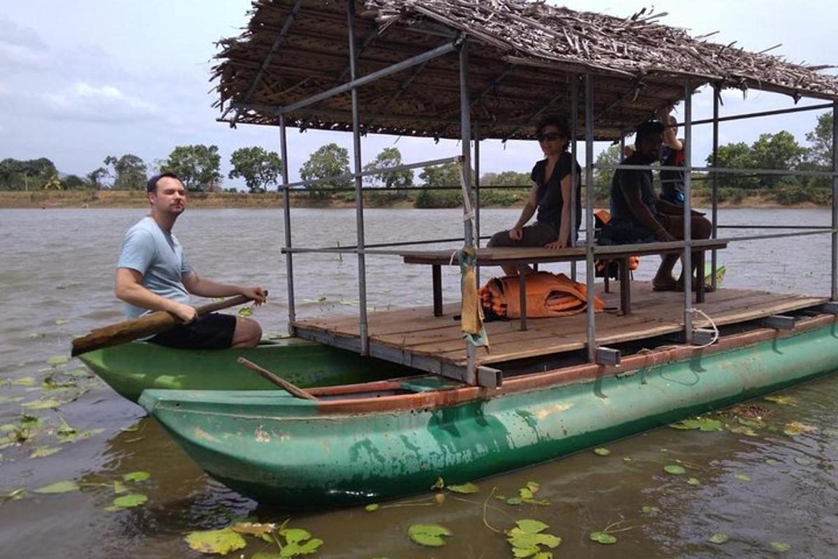 a group of people sitting on a boat in the water