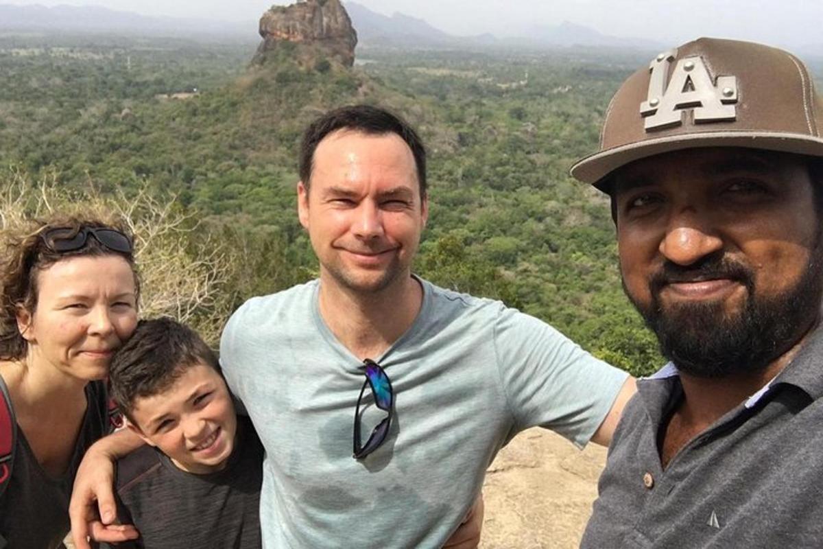 a group of people standing on top of a mountain