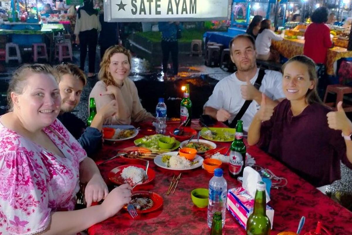 a group of people sitting at a table eating food