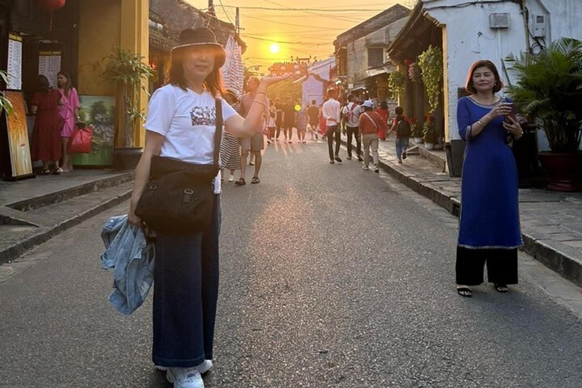 two women walking down a street in a city