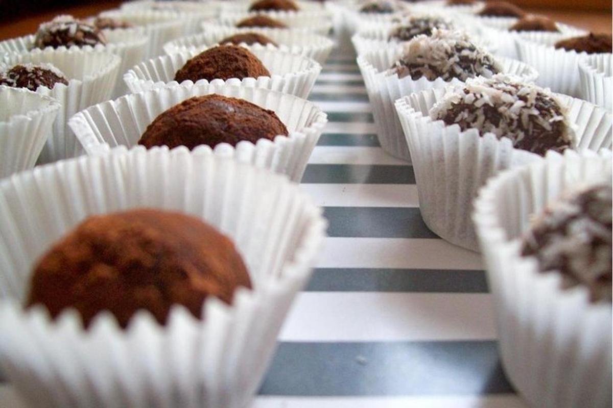 a bunch of muffins in paper cups on a table