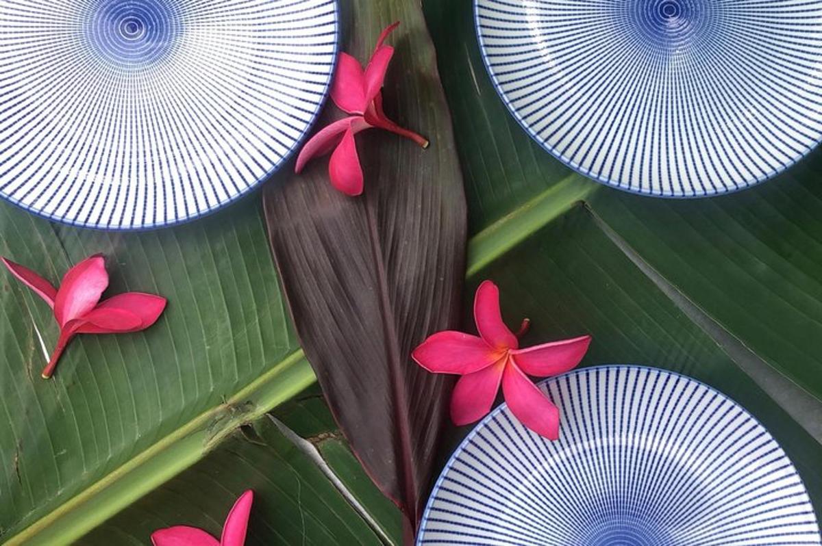 a group of purple flowers on a green leaf