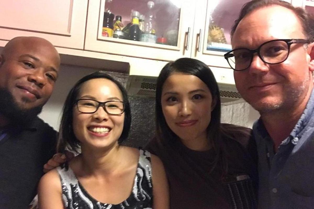 a group of three people posing for a picture