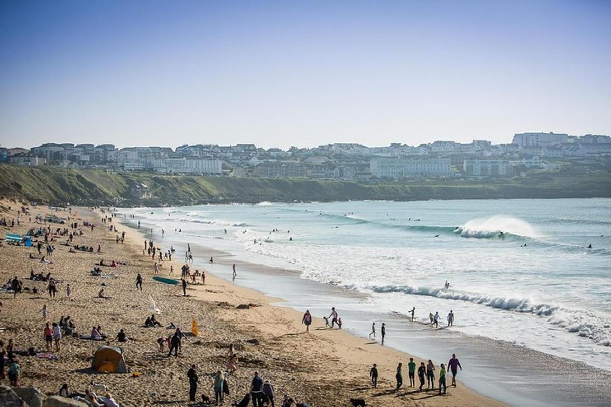 a group of people on a beach near the ocean
