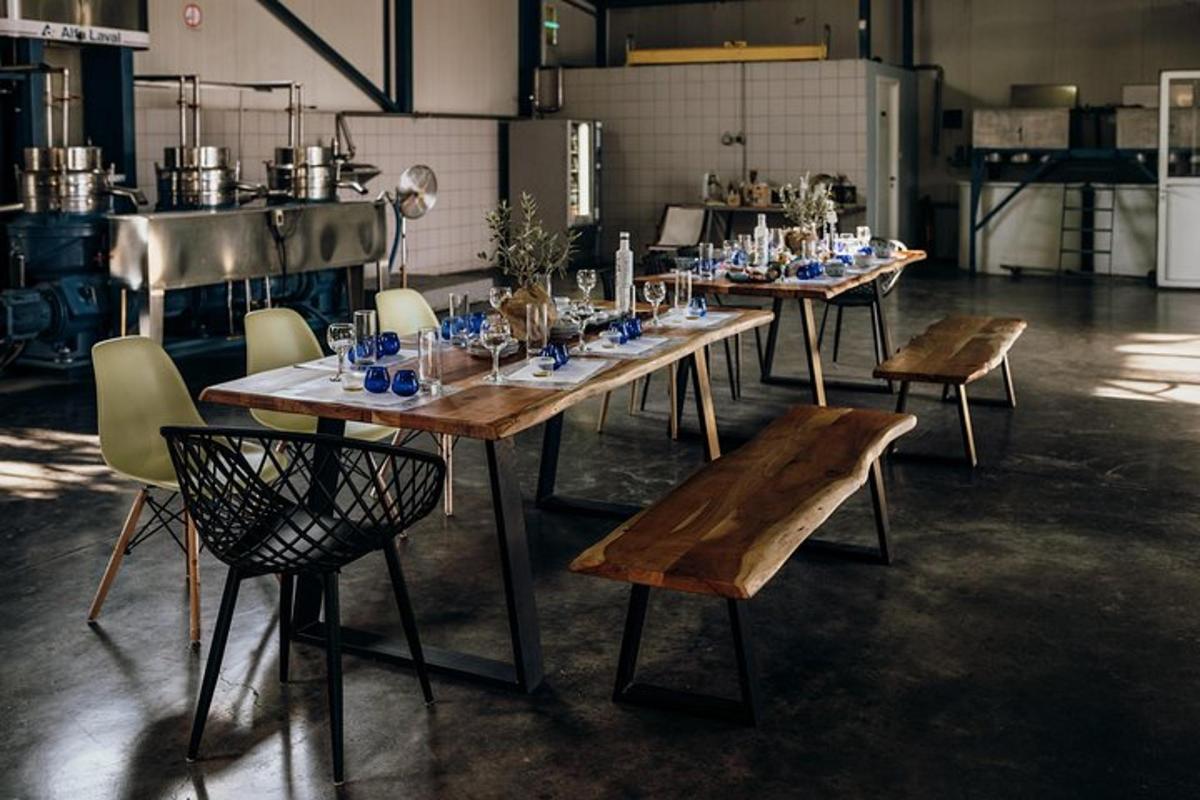 a group of tables with glasses on them in a room