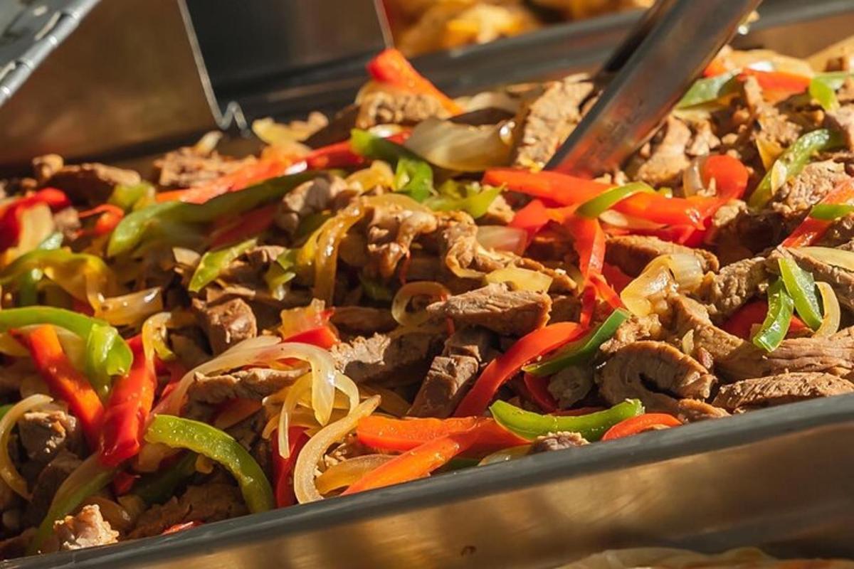 a tray of food with meat and vegetables