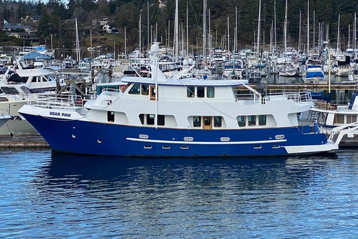 a large blue and white boat in a harbor