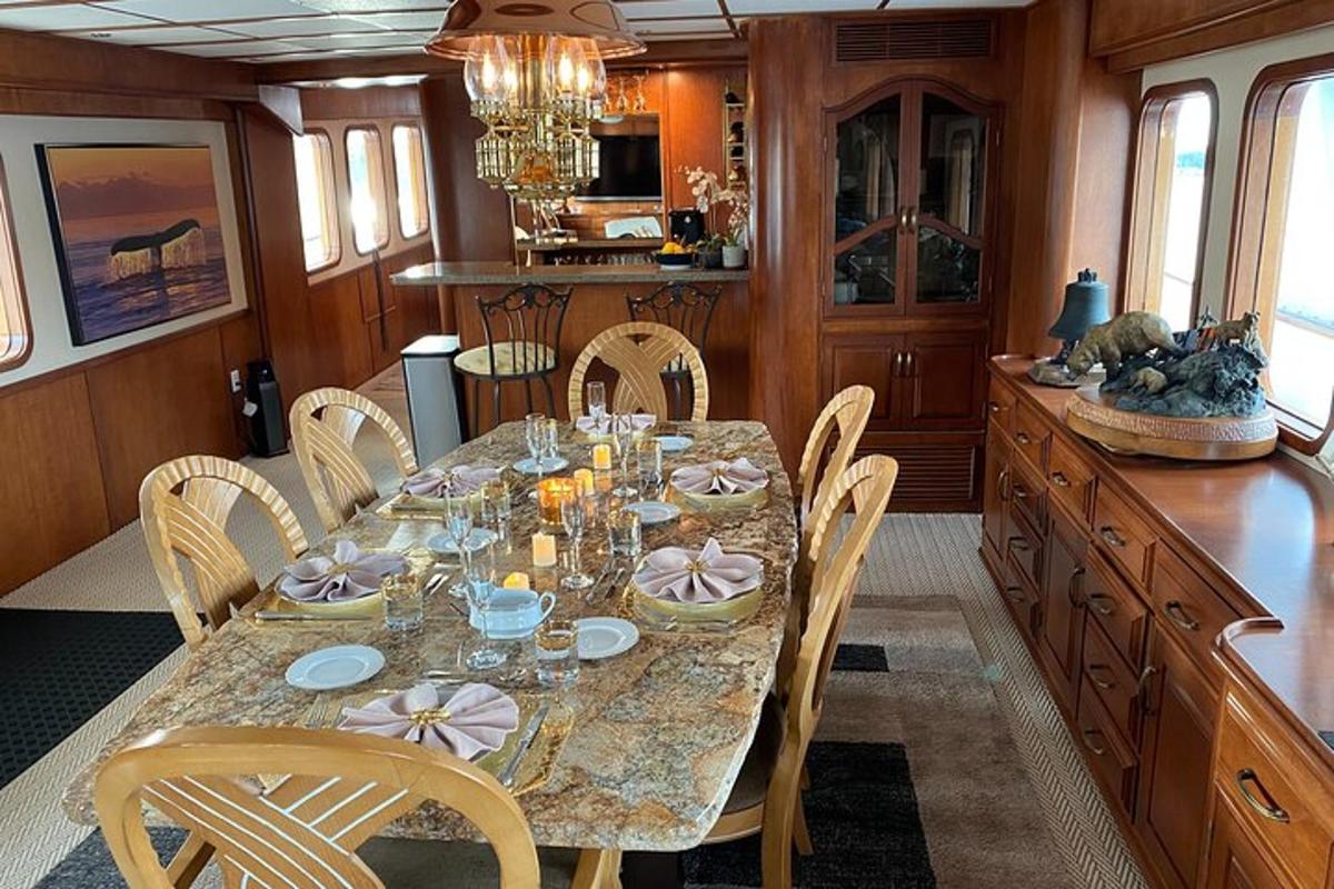 a dining room with a table and chairs in a kitchen