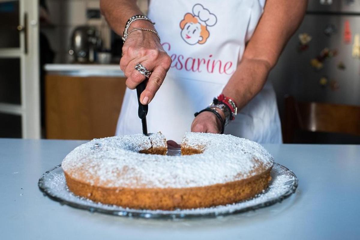 a woman is cutting a cake with a knife