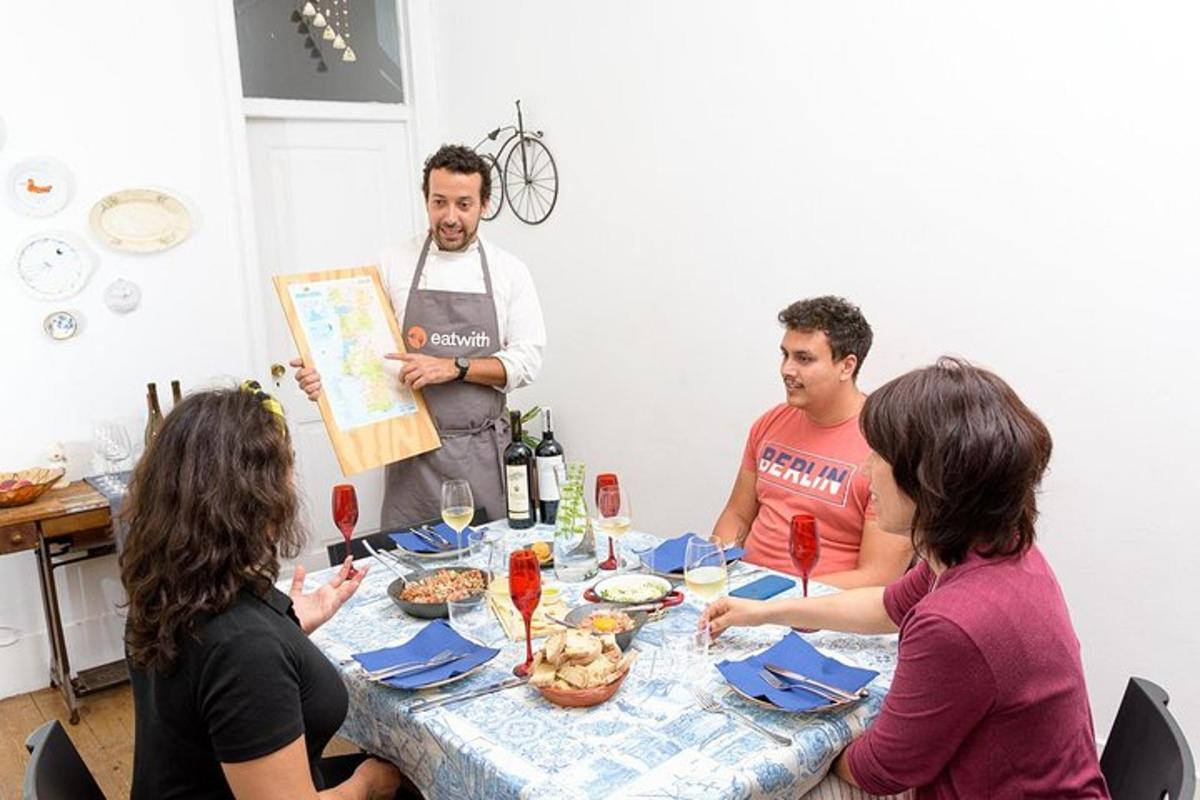 a group of people sitting around a table with food