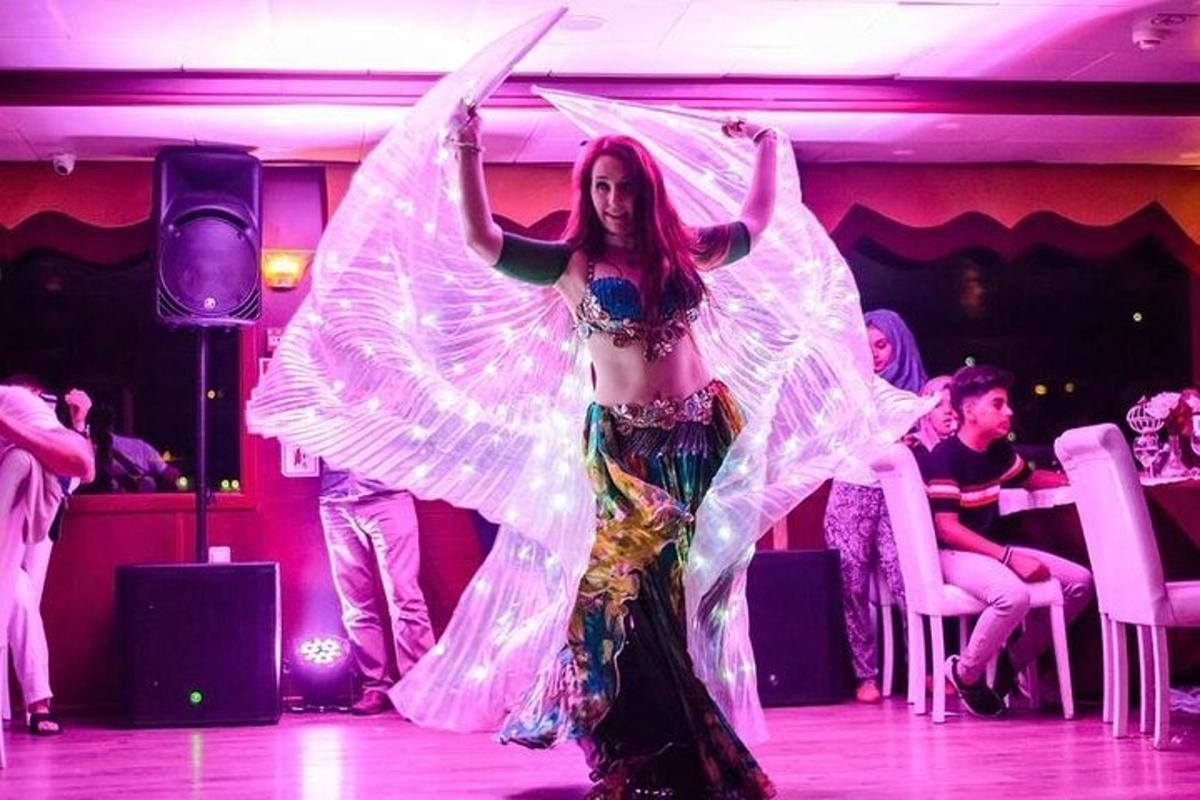 a woman in a dress on a dance floor