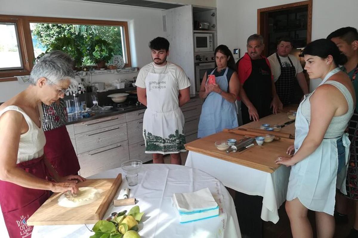 a group of people in a kitchen preparing food