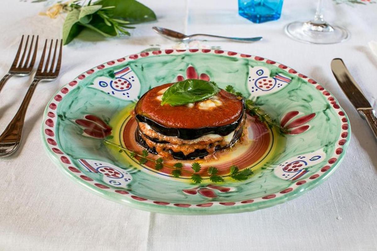a green plate with a sandwich on a table
