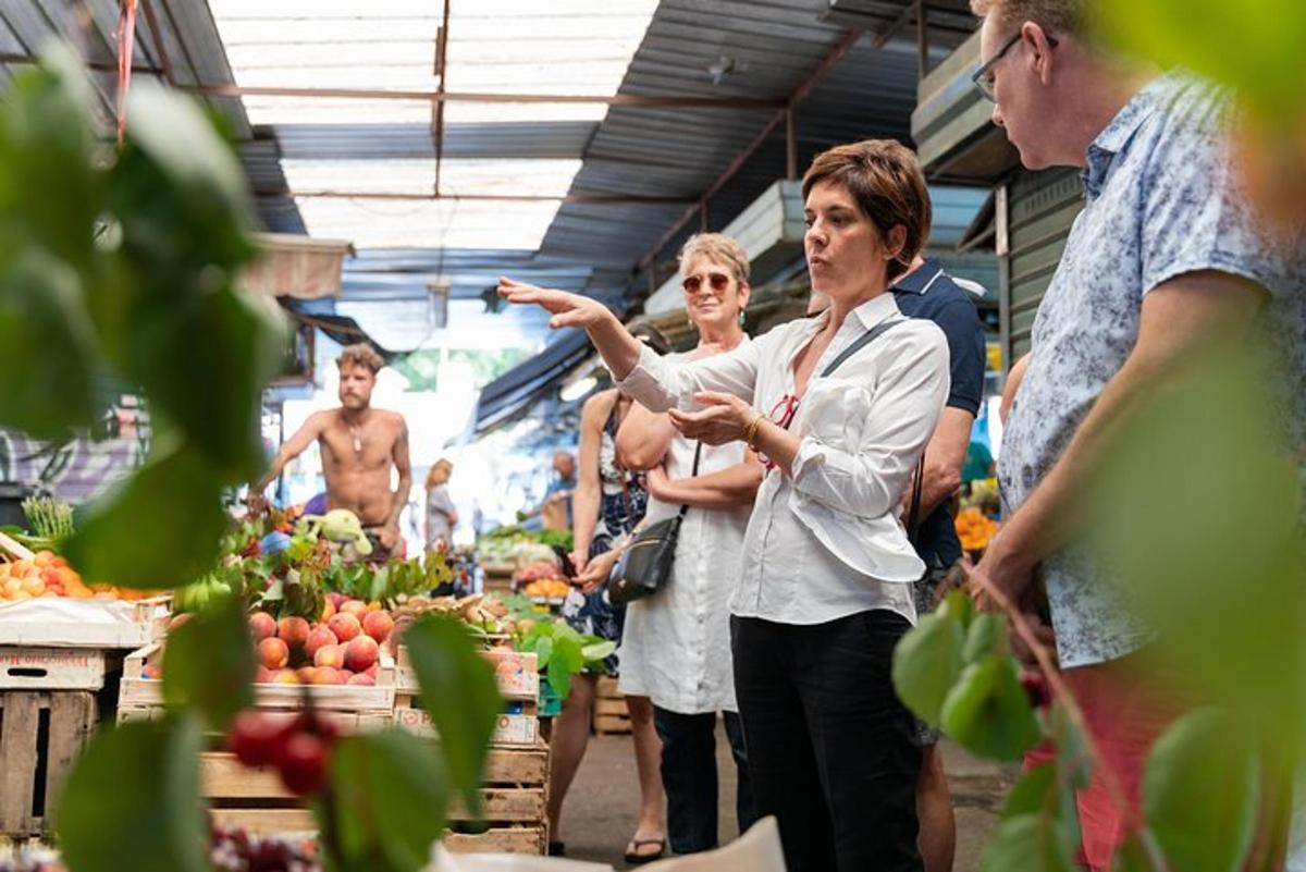 a group of people standing in an outdoor market