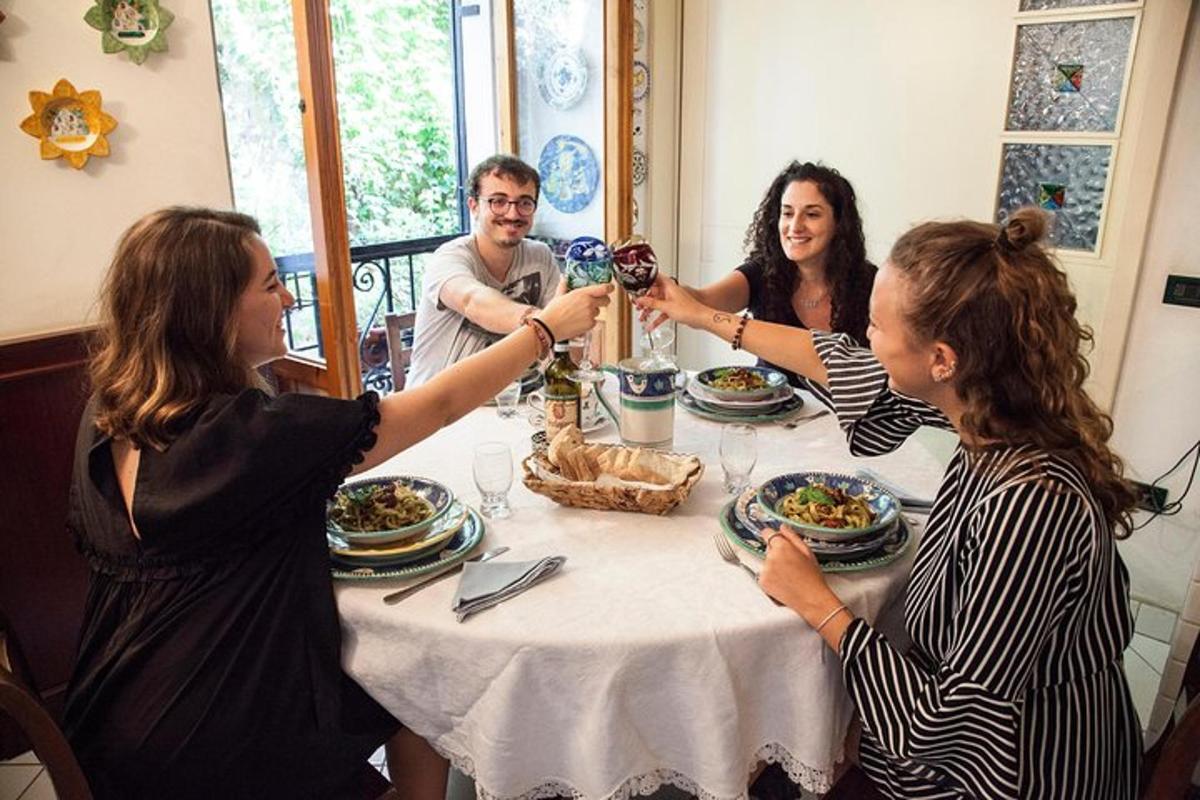 a group of people sitting around a table drinking wine
