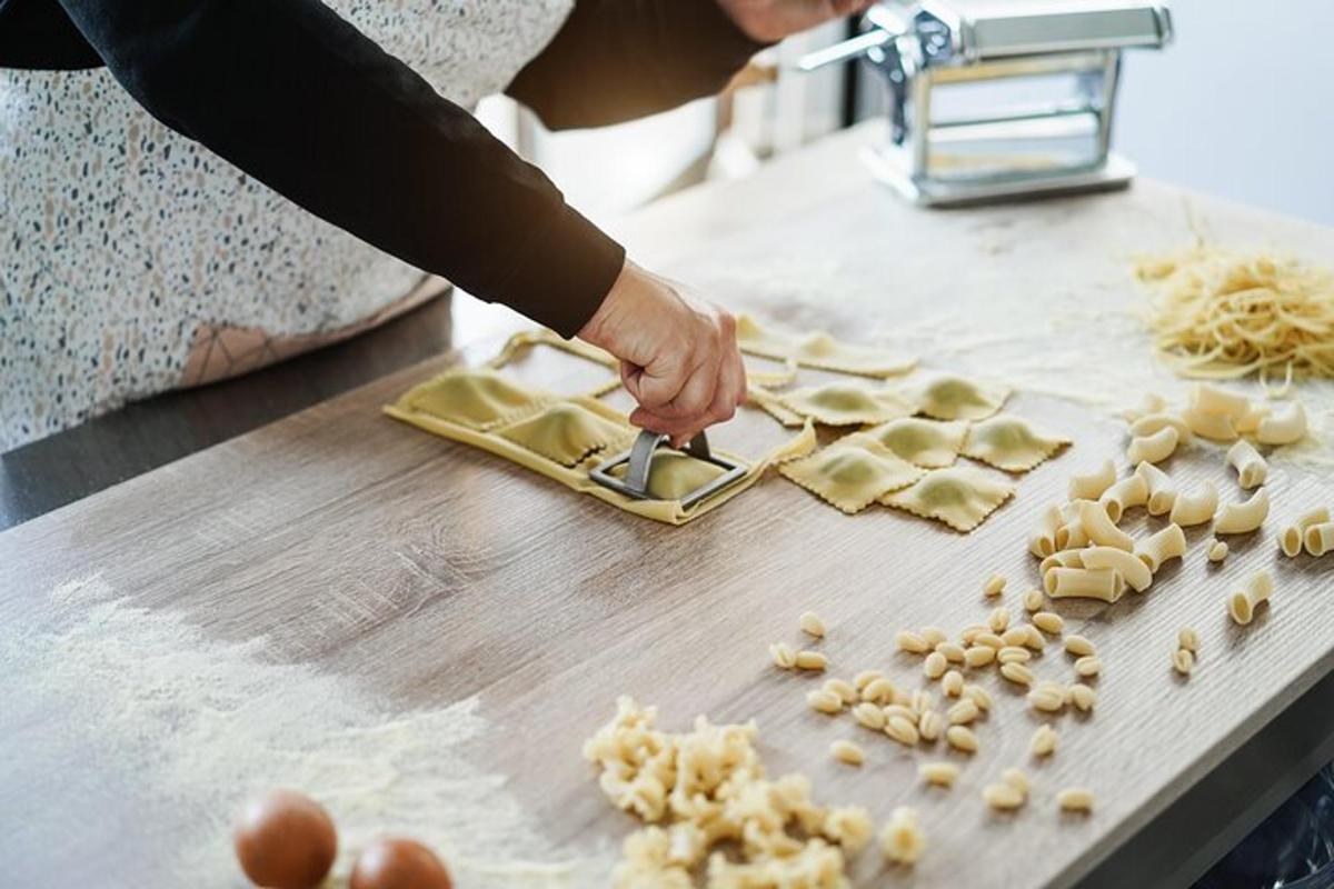 a person cutting up food on a cutting board