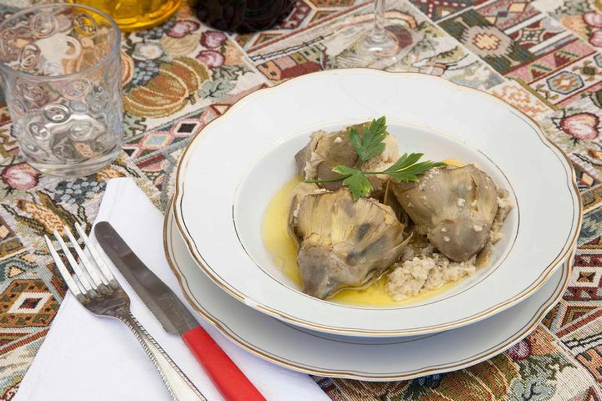 a plate of food with meat and rice on a table
