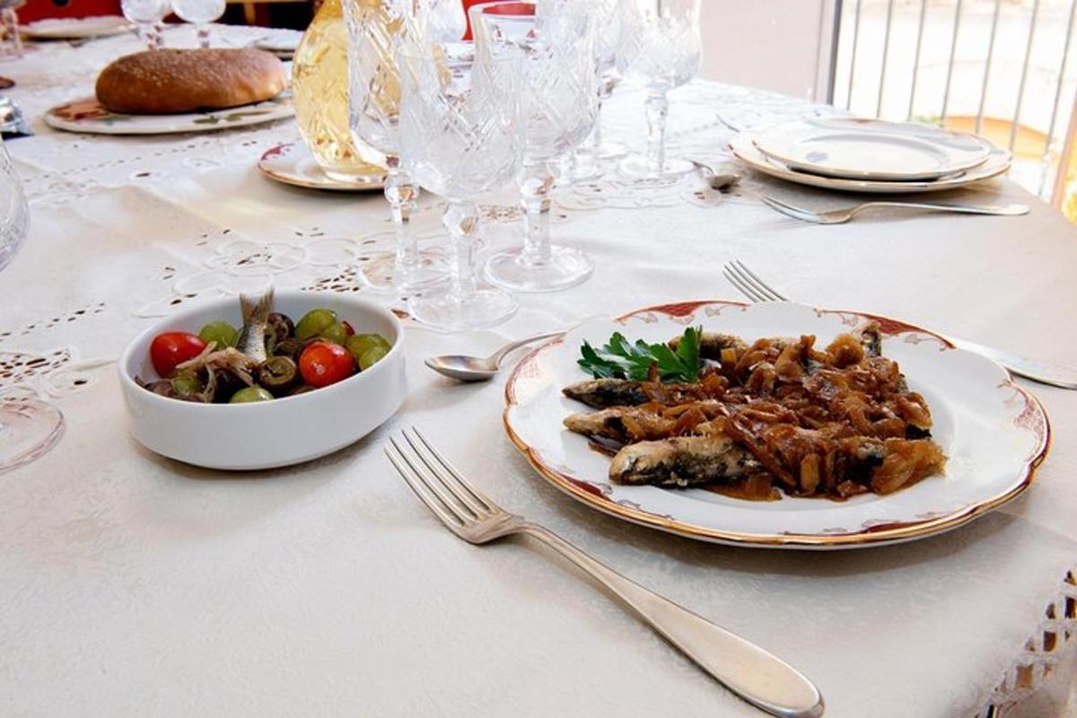 a table with a plate of food and a bowl of vegetables
