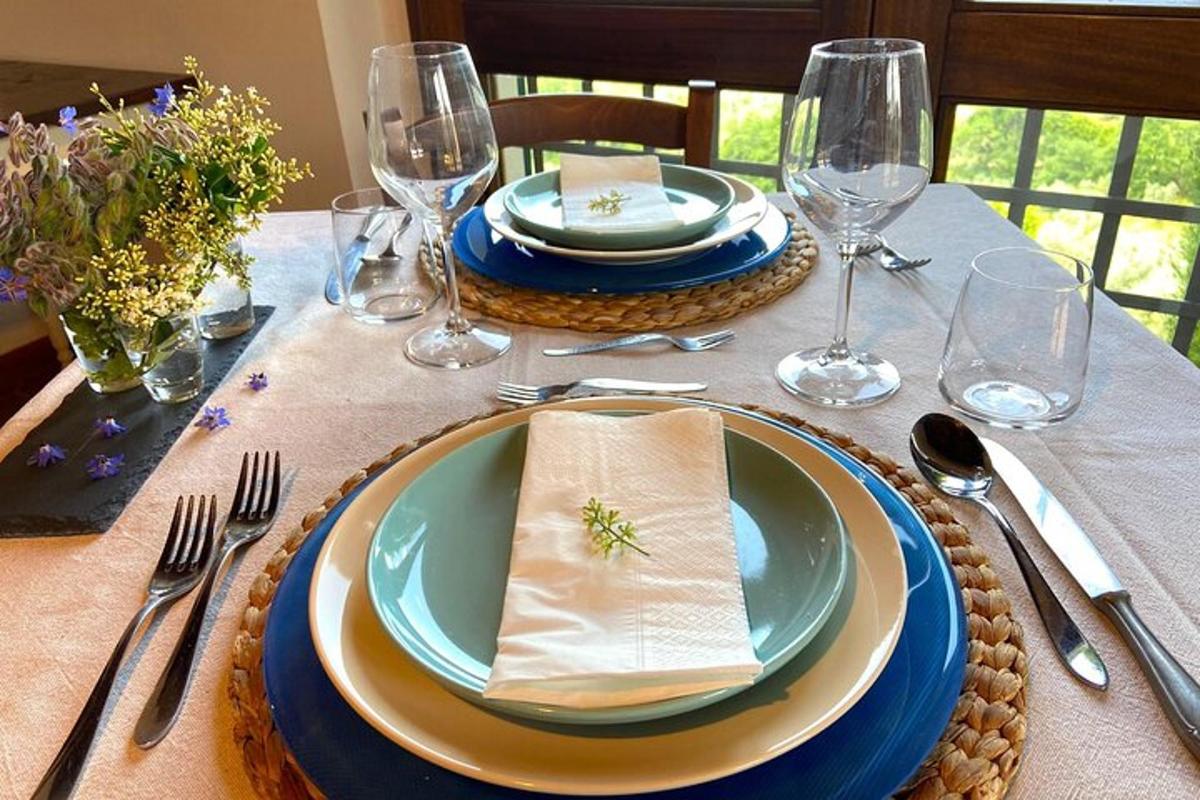 a table with plates and wine glasses on it