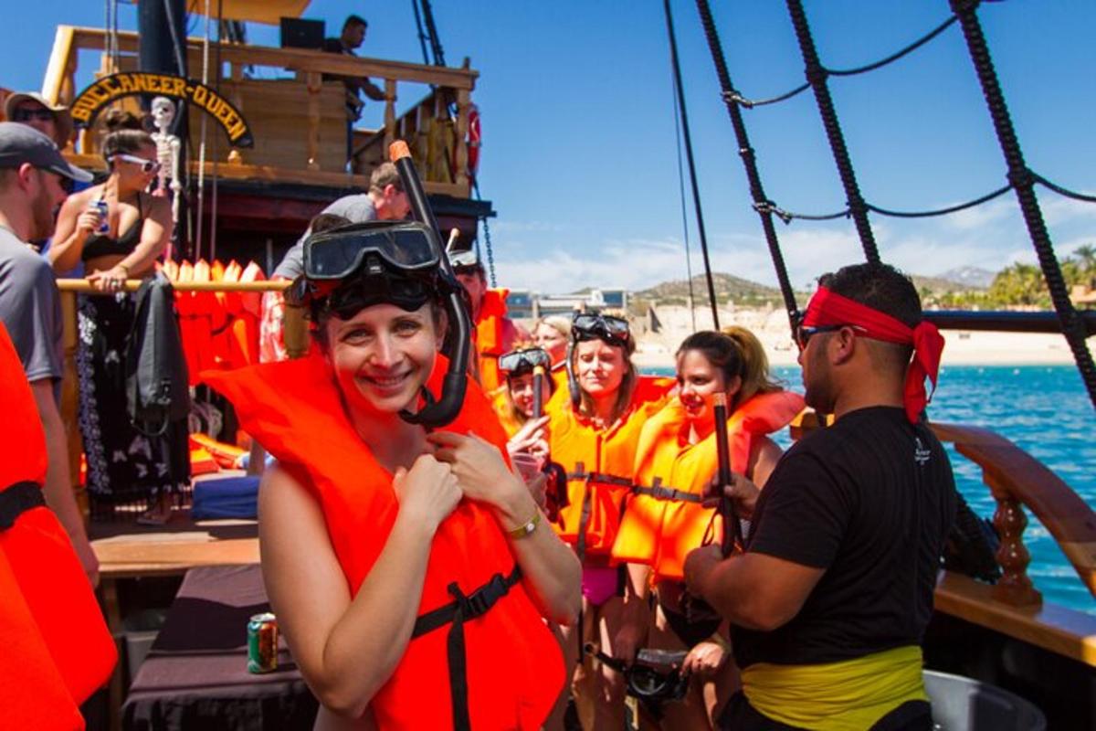 a group of people in life jackets on a boat