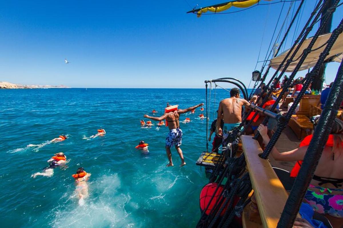 a group of people in the water on a boat
