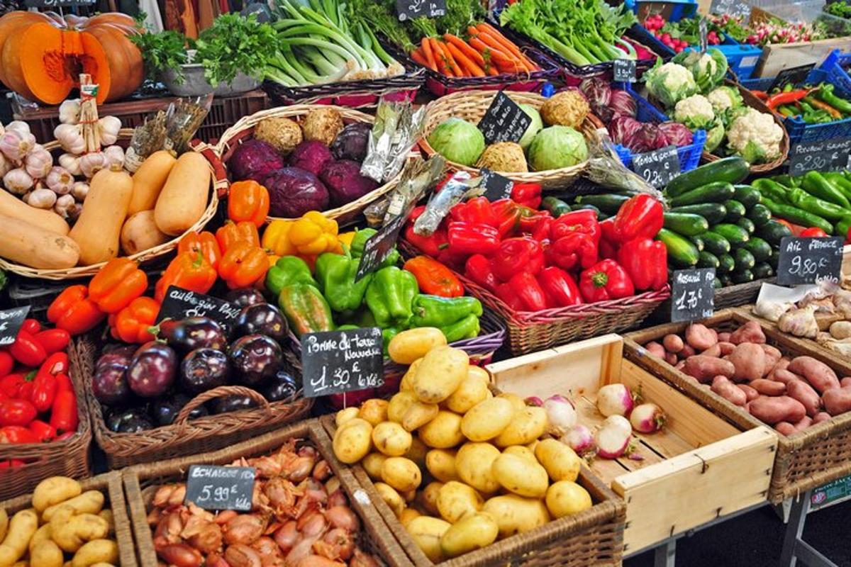 a display of fruits and vegetables in baskets at a market