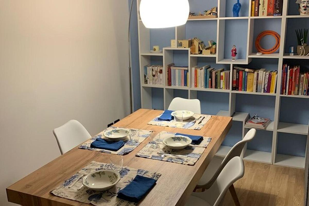 a dining room with a wooden table and chairs