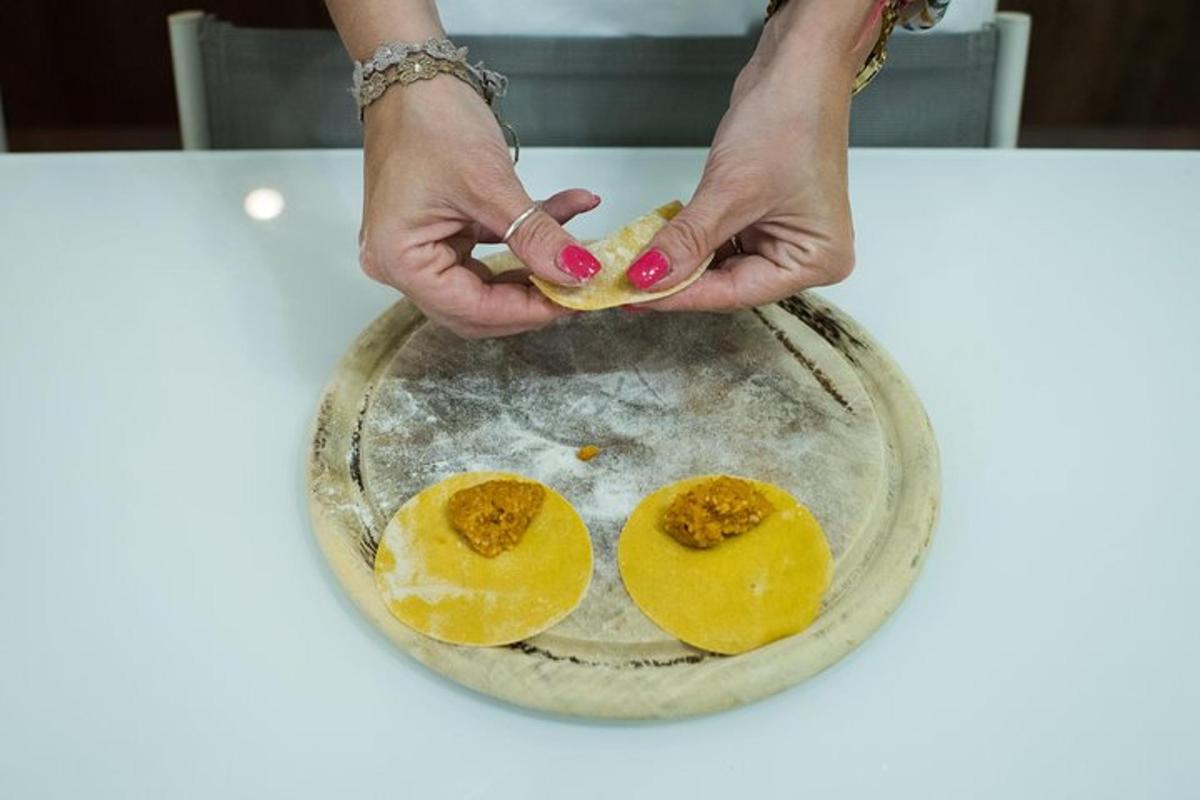 a person holding a bowl with eggs in it