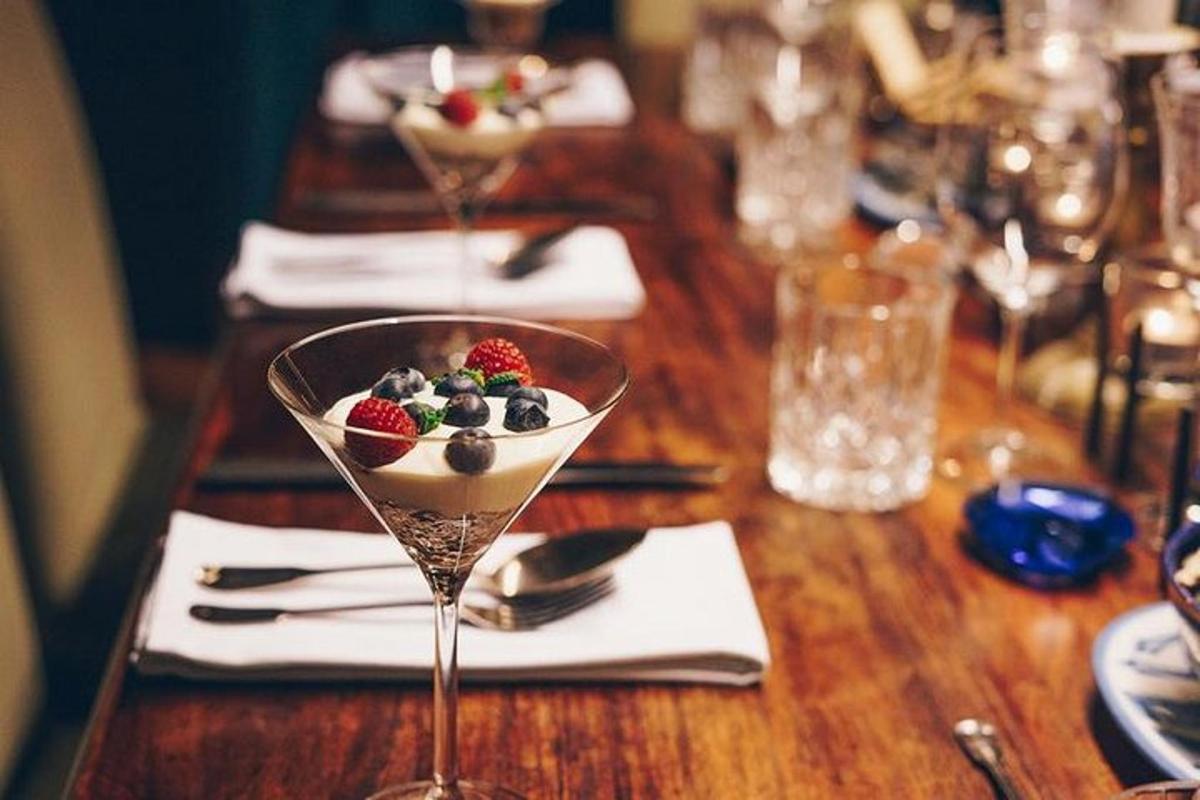 a dessert in a martini glass on a wooden table