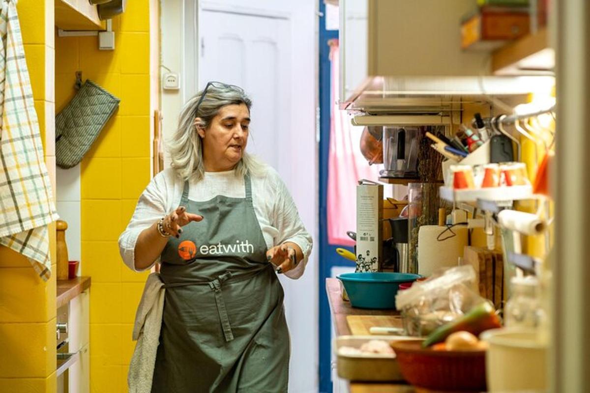 a woman standing in a kitchen in a room