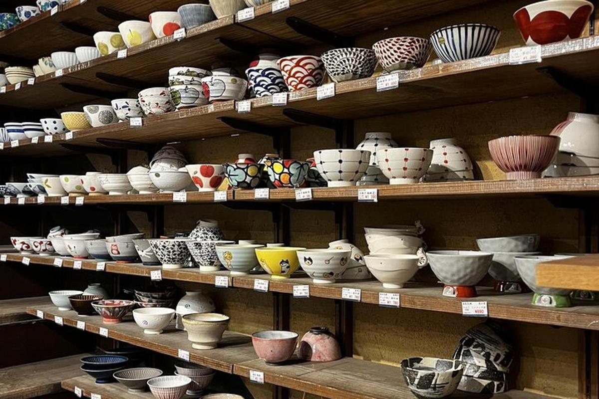 a shelf filled with lots of bowls and plates