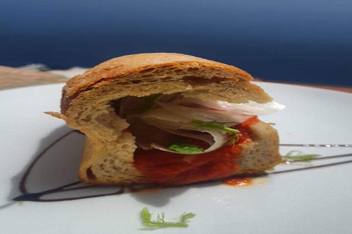 a sandwich sitting on top of a white plate