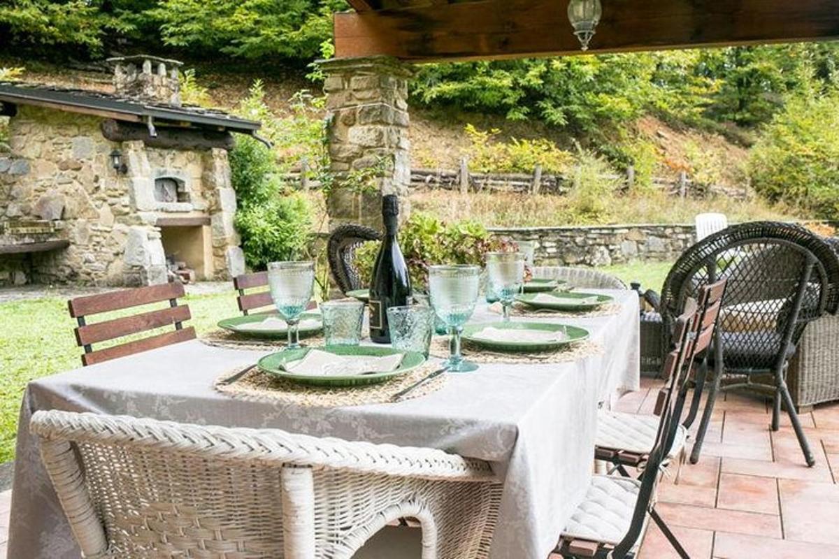 a table with a white table cloth on a patio