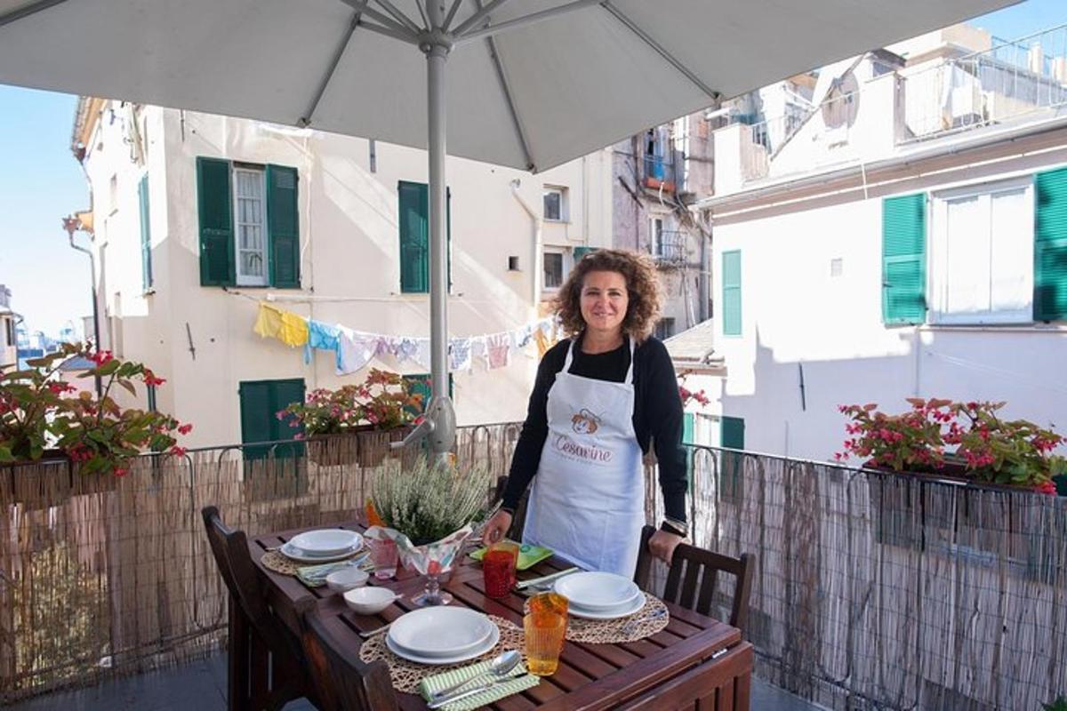 a woman standing next to a table with an umbrella