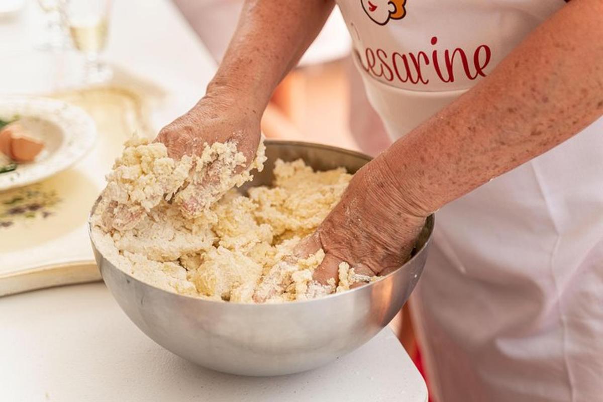 a person mixing food in a bowl on a counter