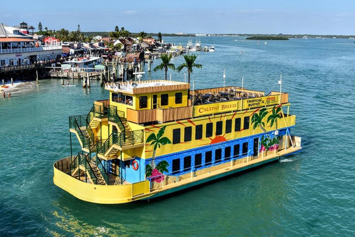 a yellow boat in the water next to a dock