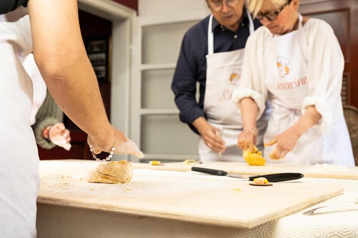a group of people in a kitchen preparing food