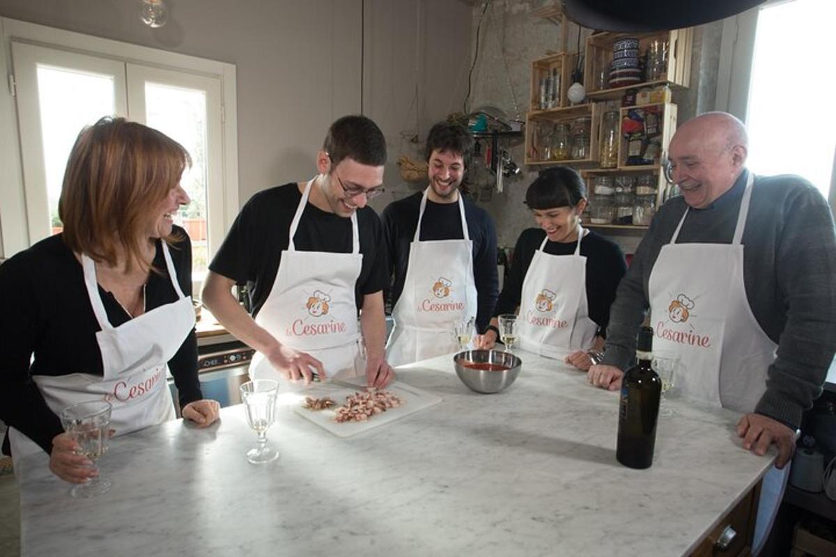 a group of people standing around a counter preparing food