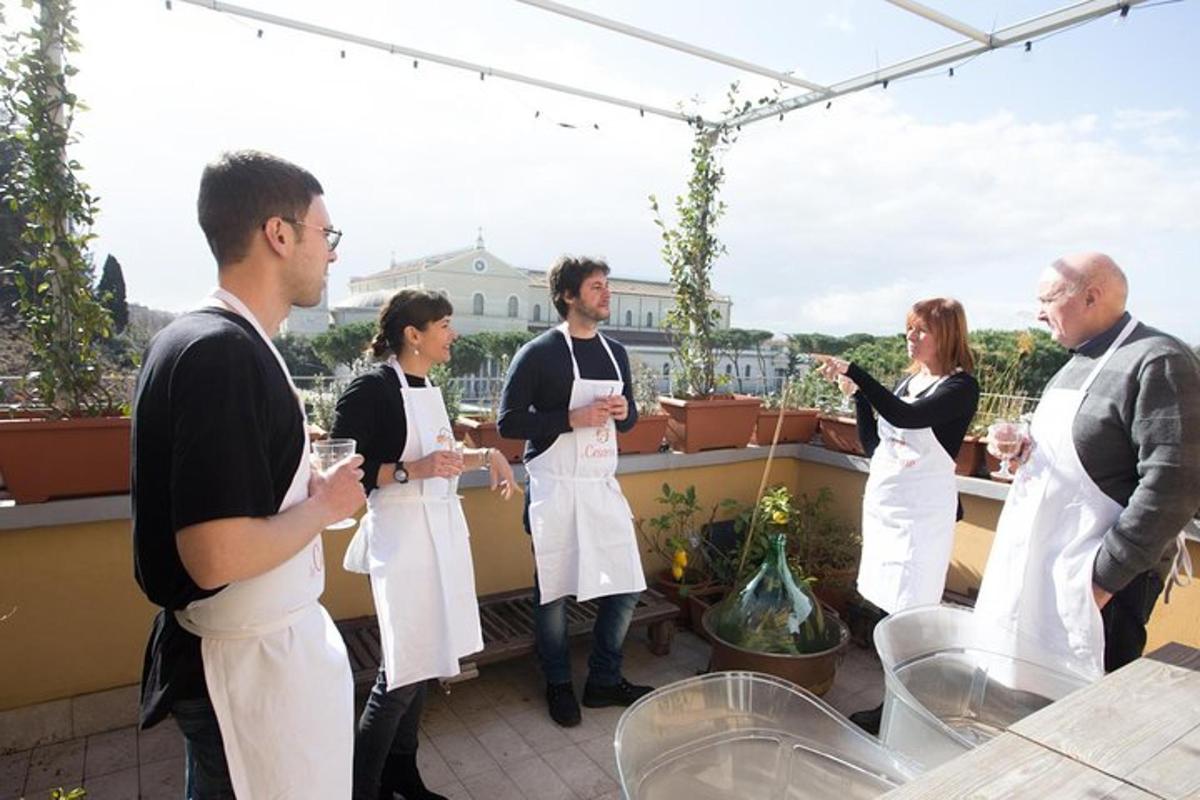 a group of people in aprons standing on a balcony