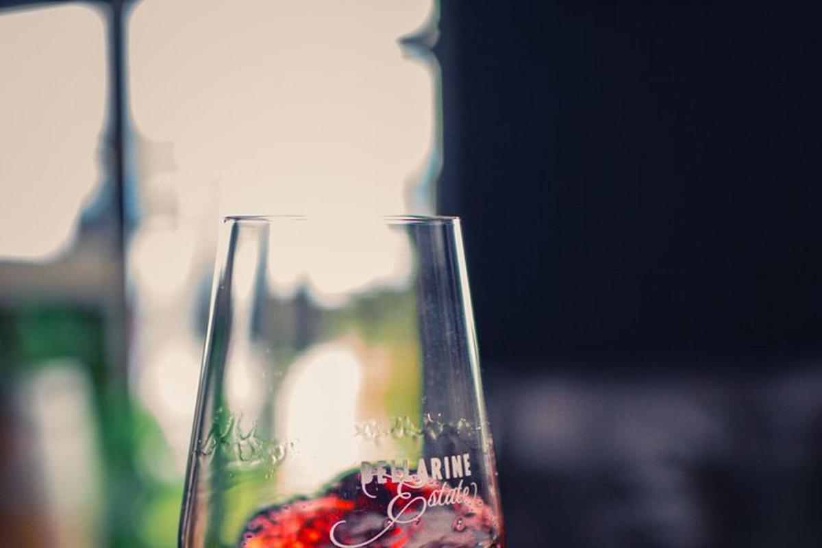 a close up of a wine glass with a strawberry in it