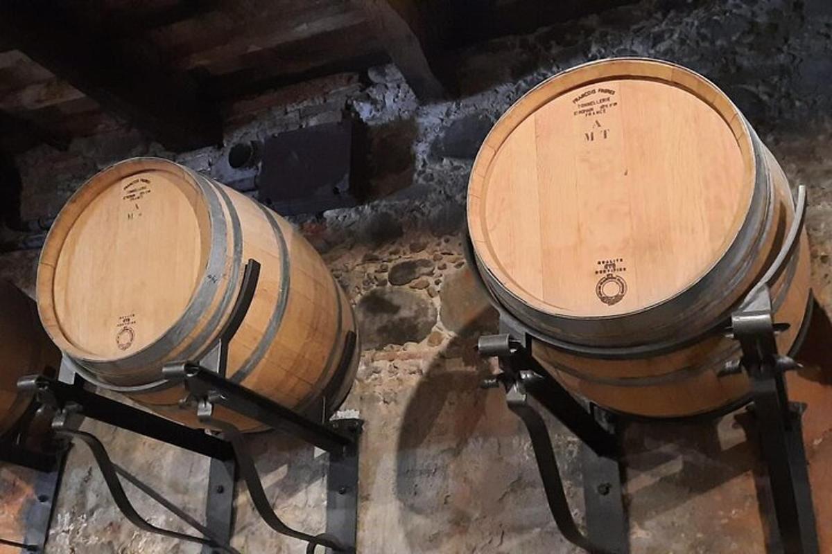 two wooden barrels sitting next to each other